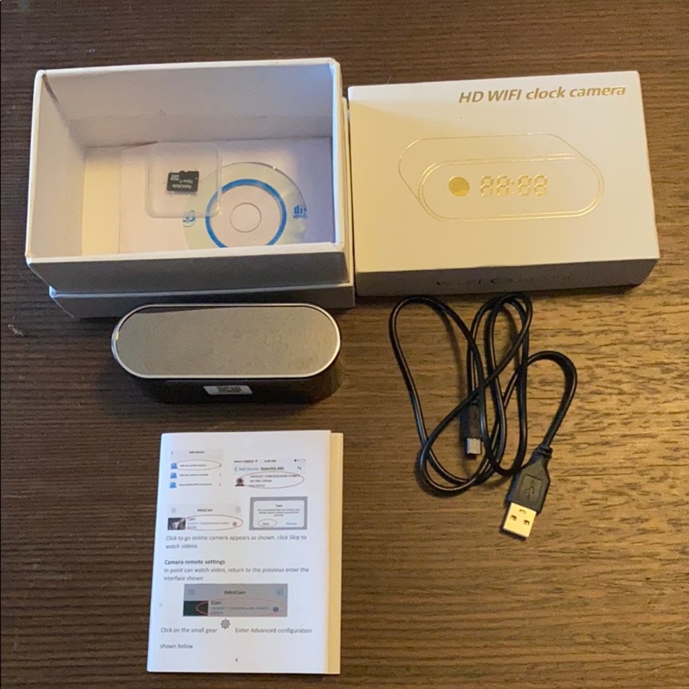Electronic clock with a hidden camera